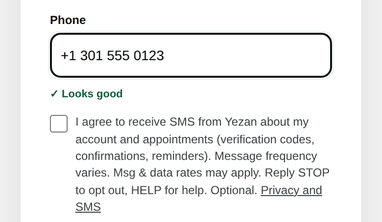 Sign-up form: phone field followed by the unchecked SMS consent box
